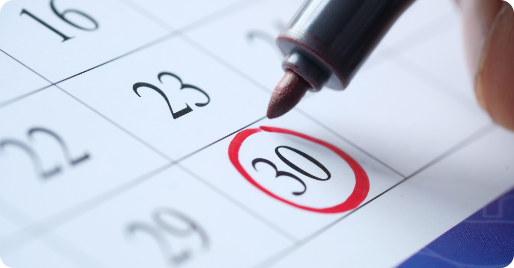 Person marking a calendar